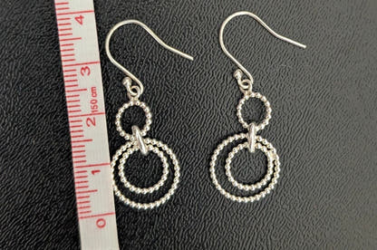 Silver Dangling Circular Rope Earrings Sparkle