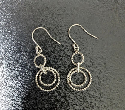 Silver Dangling Circular Rope Earrings Sparkle