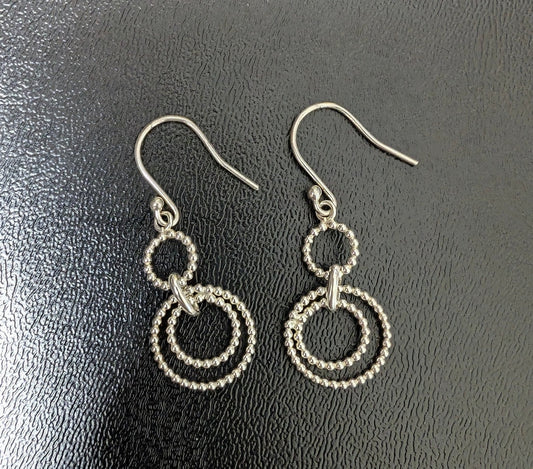 Silver Dangling Circular Rope Earrings Sparkle